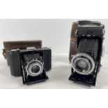 2 vintage Zeis Ikon cameras in original brown leather cases & concertina fold-out lenses. A Zeiss