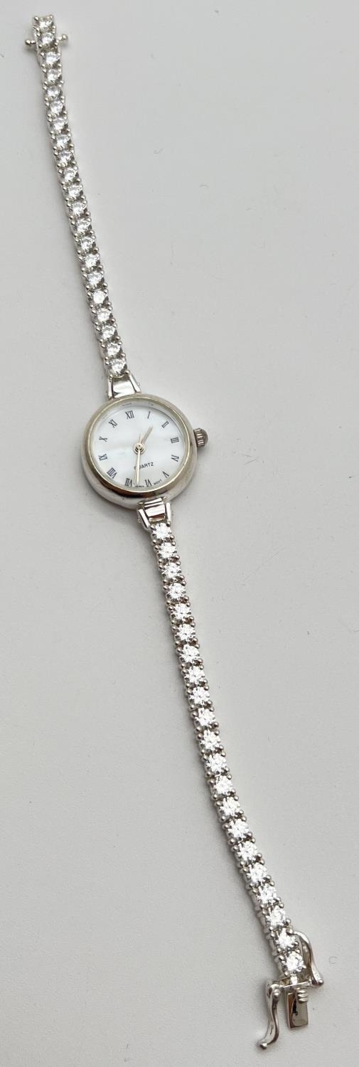 A modern silver cased ladies quartz wristwatch with mother of pearl face and clear stone set - Image 3 of 4