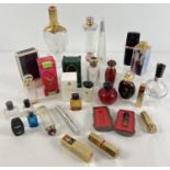 A collection of modern and vintage empty perfume bottles, boxes and lipsticks. To include Dior, Yves