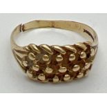A 9ct gold keeper ring for scrap or repair - ring cut through. Gold marks to inside of band. Size T,