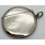 An Edwardian silver circular shaped vesta case with side hanging bale. Fully hallmarked to inside