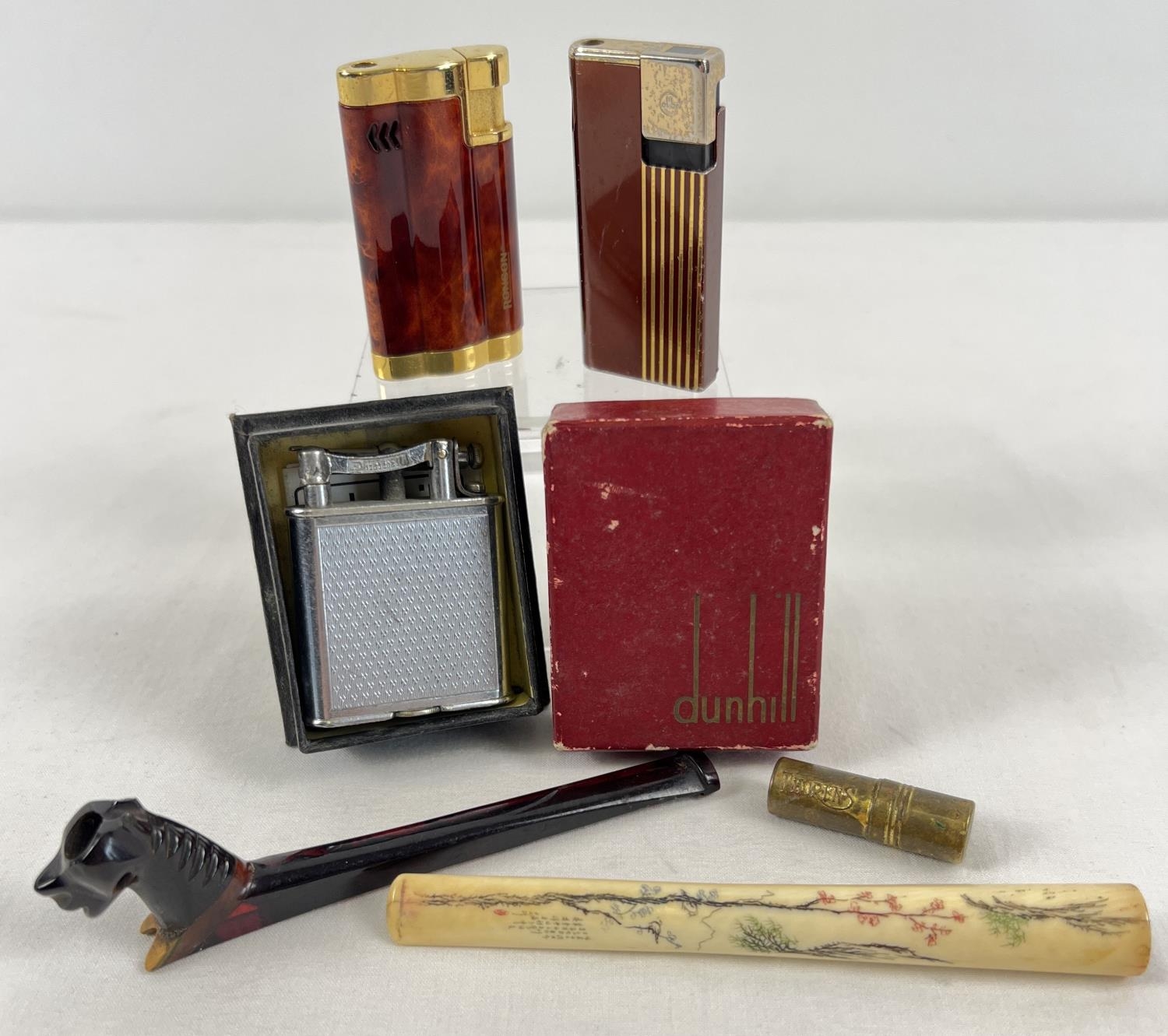 A small collection of assorted vintage smoking related items to include lighters and cigarette