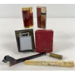 A small collection of assorted vintage smoking related items to include lighters and cigarette