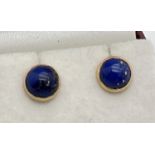 A pair of 18ct Egyptian gold stud earrings set with lapis lazuli. Gold marks to earring posts and