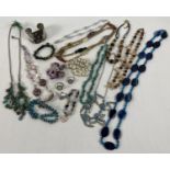 A collection of assorted vintage and modern costume jewellery to include natural stone items. Lot