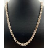 A 20 inch vintage silver byzantine style chain necklace with spring clasp. Silver marks to