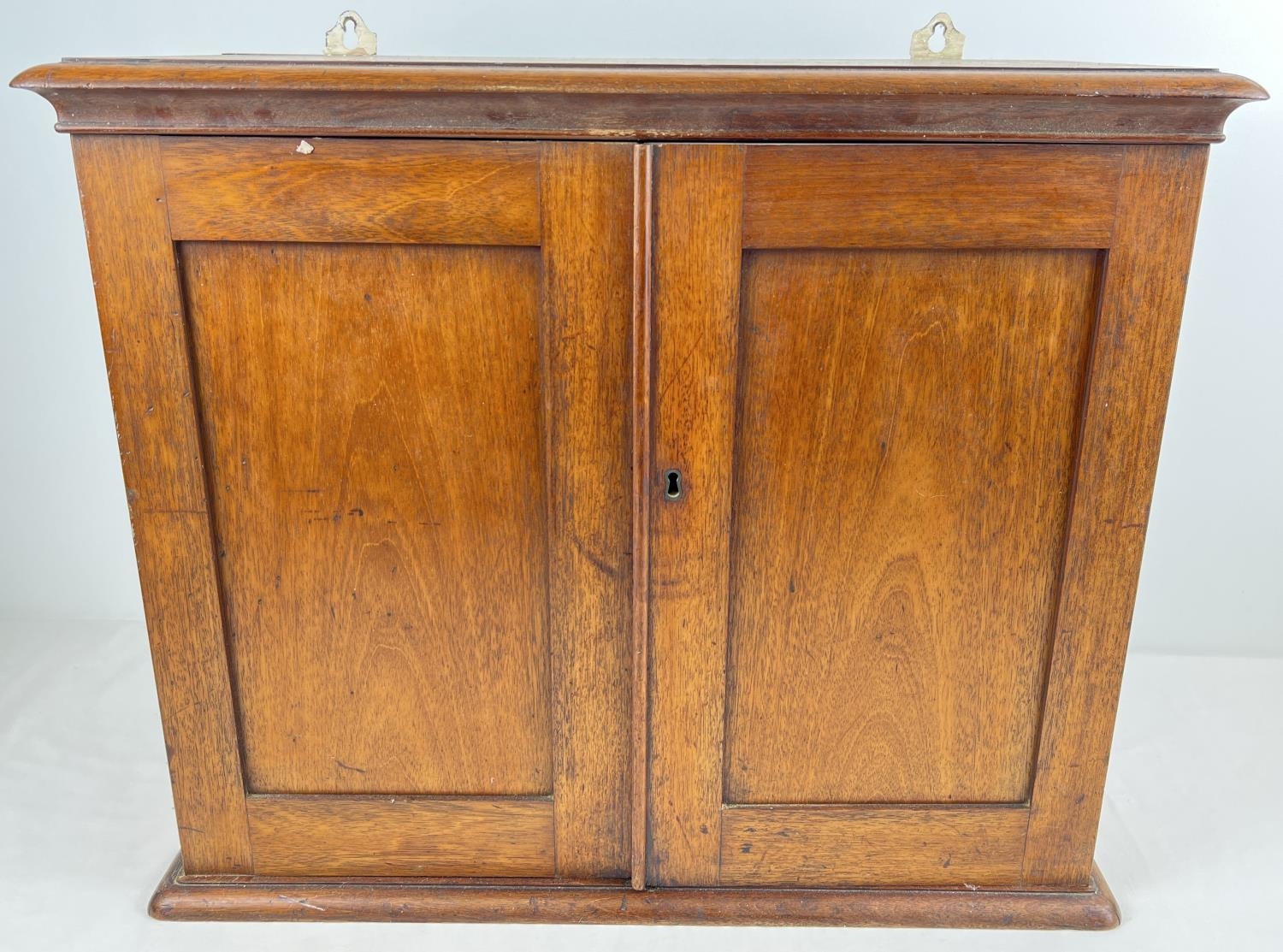 A vintage mahogany 2 door small wall hanging cupboard with adjustable interior shelf. approx. 49 x