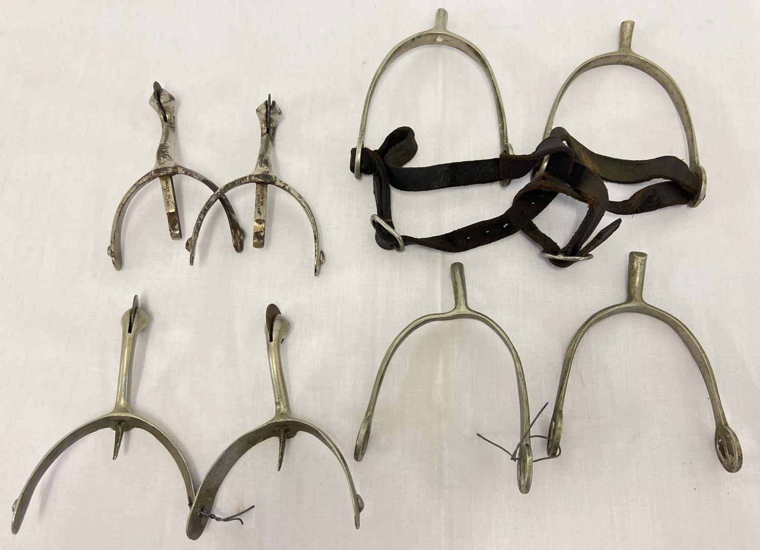 4 pairs of military boot spurs, to include 2 pairs of swan neck spurs and a pair of riding spurs