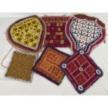 A collection of 6 vintage Central Asian heavily beaded and embroidered fabric panels. In varying