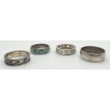4 silver band style rings. Varying designs to include wave decoration, pierced work and turquoise