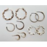 5 pairs of hoop style silver earrings in varying sizes to include 2 of twisted design. Total