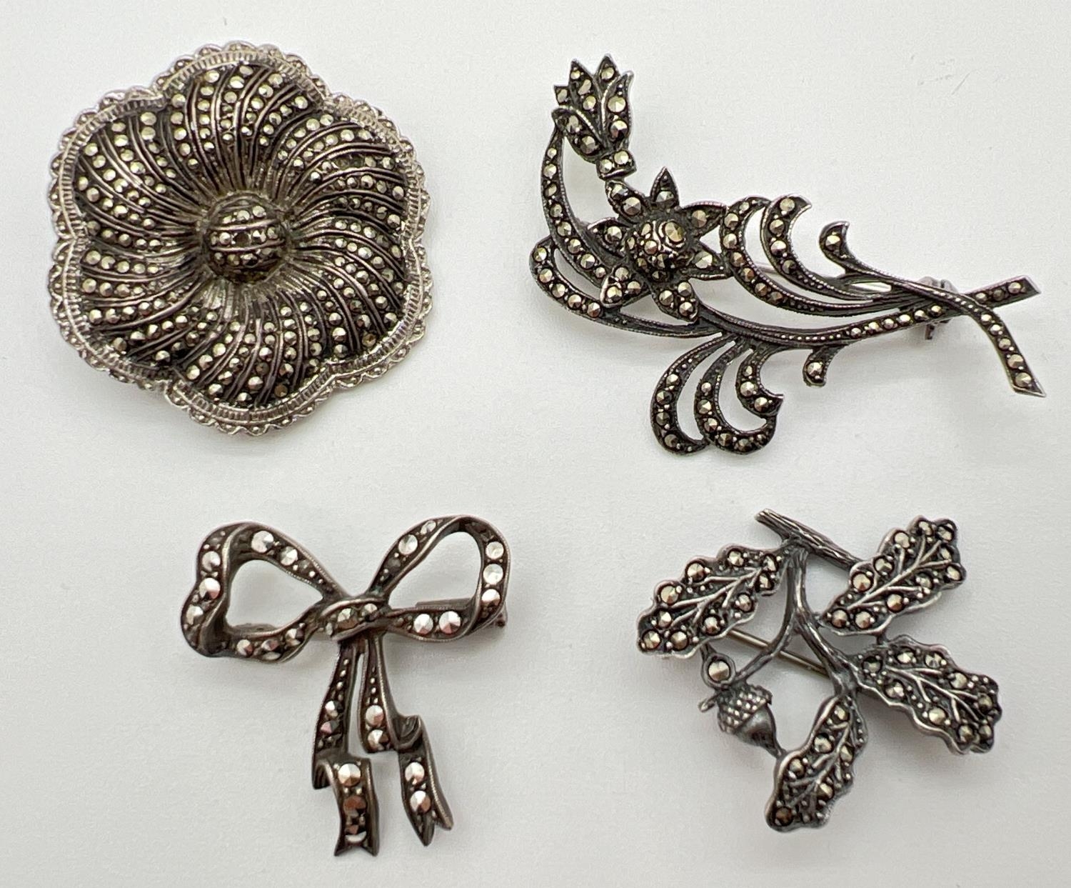 4 vintage silver marcasite set pin backed brooches, all stamped to reverse.