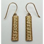 A pair of 9ct gold vintage drop style earrings with diamond shaped decoration to fronts. Each