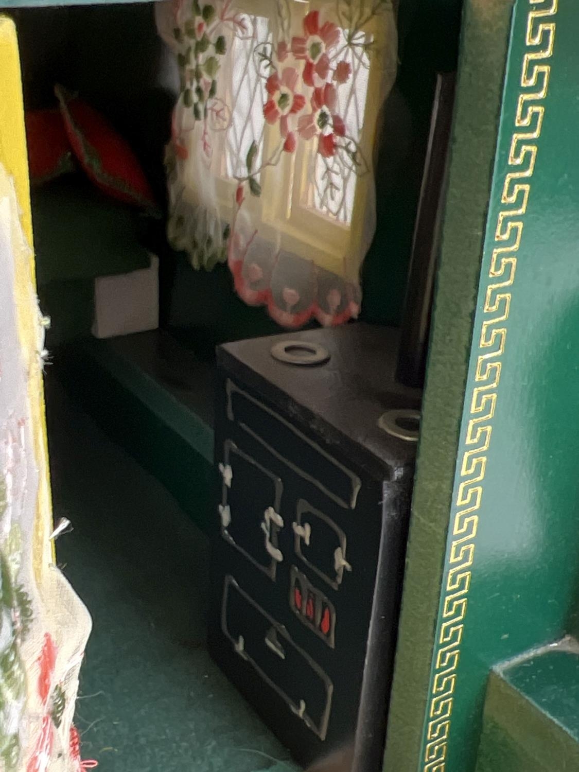 A painted wooden model of a Gypsy caravan with hand painted and sticker detail and green felt - Image 6 of 9