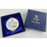 A boxed Royal Doulton Bunnykins circular enameled trinket box. Depicting a lady rabbit picking