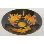 A large Poole Pottery 'Aegean' ceramic bowl in autumnal colours with oak leaf design. Approx. 34cm