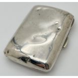 A Victorian silver curve backed cigarette case with gilt lined interior. Hinge in good order and