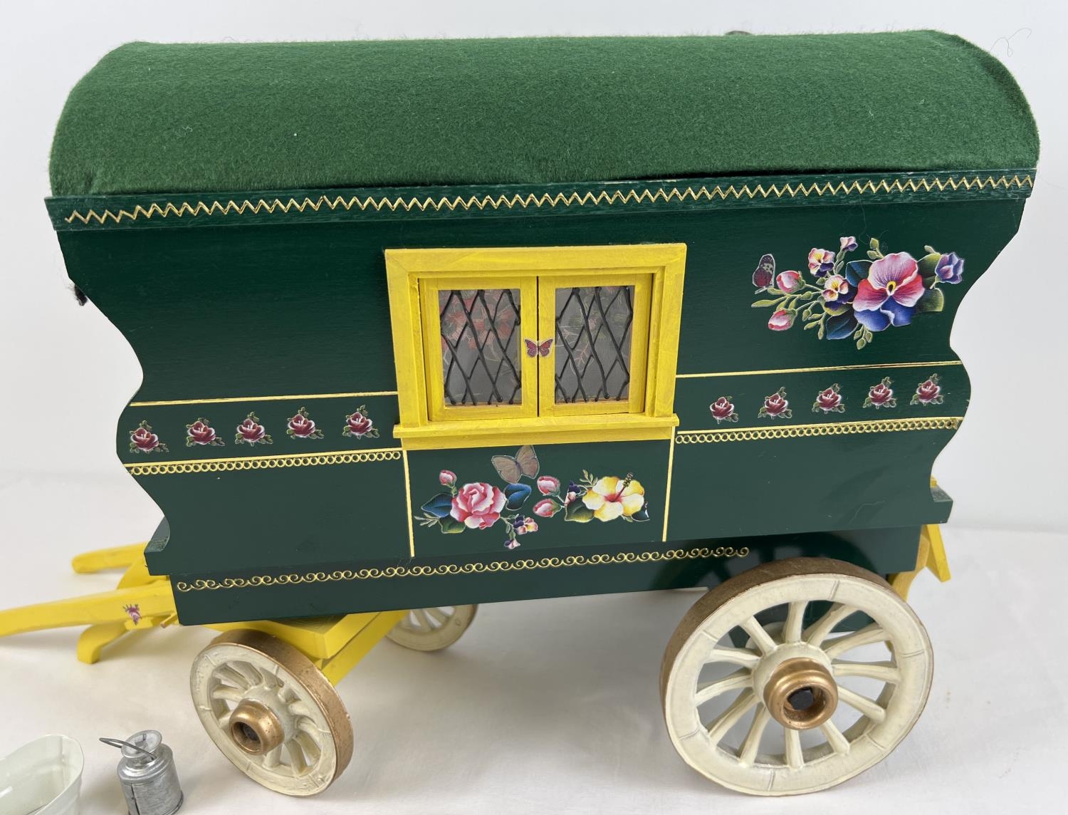 A painted wooden model of a Gypsy caravan with hand painted and sticker detail and green felt - Image 8 of 9