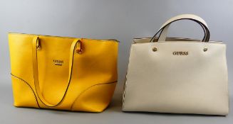 2 Lederhandtaschen der Firma Guess, geringe Gebrauchsspuren, gelb/beige,