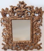 Spiegel, Holz, aufwendiger Rahmen, reich geschnitzt, H. ca. 97, B. 80 cm,