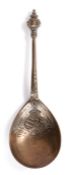 A tinned copper-alloy spoon, German, dated 1647, the large fig-shaped bowl cast with a crowned