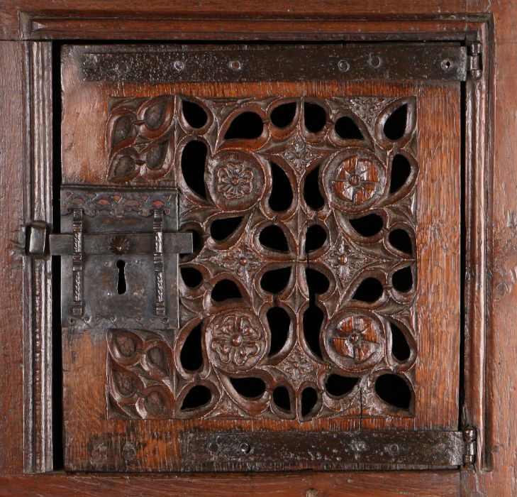 A magnificent and rare Henry VIII joined oak aumbry or livery cupboard, circa 1520, the front - Image 10 of 16