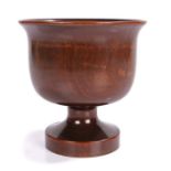 Late 17th Century treen sycamore goblet, the wide flared edge above a dumpy stem and circular
