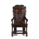 An impressive and good Charles II joined oak and inlaid double panel-back open armchair, South-