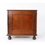 Small William and Mary oak and elm enclosed chest, the rectangular top above a single panel door