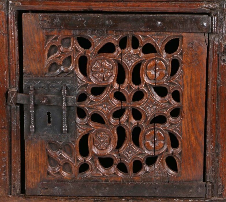 A magnificent and rare Henry VIII joined oak aumbry or livery cupboard, circa 1520, the front - Image 7 of 16