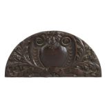 17th Century oak architectural carving, possibly a door pediment, the arched panel designed with