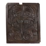 Charles II carved oak panel, Lancashire, with two bunches of grapes to the centre and a flower and