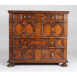 Charles II oak geometric chest of drawers, the rectangular top above four long geometric drawers