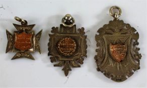 Three silver pocket watch chain pendants presented to Miss L.C. Davidson, inscribed "Presented to