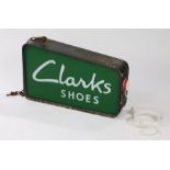 Clarks Shoe shop double sided sign, in green with Clarks Shoes in white lettering with a black metal