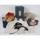 Japanese ephemera to include stacking lacquered bento boxes, pair of woven boots, green tea box,