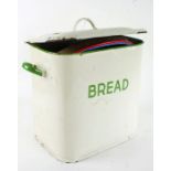 1970's/80's enamel bread bin, in cream and green, with lid, together with a set of six glass storage