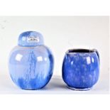 Ruskin pottery vase, the bulbous body with lid decorated in blue, impressed mark to the base,