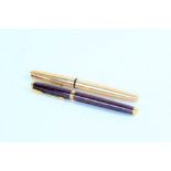 Parker - two fountains pens, the first with wood effect case and 14k nib, the second with 12ct