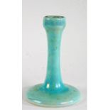 Ruskin pottery candlestick, the lustre body of slender tapering form, terminating into a wide