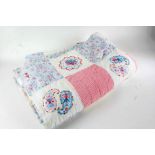 Paisley pattern patchwork quilt, in red, white and blue, with chequered patchwork to one side and