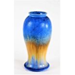 Ruskin pottery vase, the shouldered neck above a bulbous tapering body, terminating into a wide