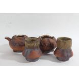 Japanese art pottery set, 20th century, comprising pot, bowl and two cups, stamped 'Ashiya' (4)