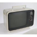 Hitachi Solid State portable television, the white body with carrying handle, 42cm wide