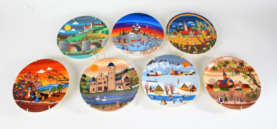 Seven Poole pottery plates, decorated with stylised landscape scenes, to include Autumn I and II,