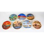 Seven Poole pottery plates, decorated with stylised landscape scenes, to include Autumn I and II,