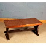 Copper and oak low stretcher table, having oblong copper top raised on shaped supports united by a