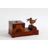 Novelty treen cigarette dispenser, in the form of a pecking bird, 18cm long