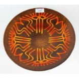 Poole pottery Aegean charger, in brown with abstract motifs in orange, 26.5cm diameter