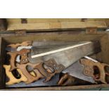 Collection of hand saws, including Nonpareil, Disston, Eclipse. and further unmarked examples,